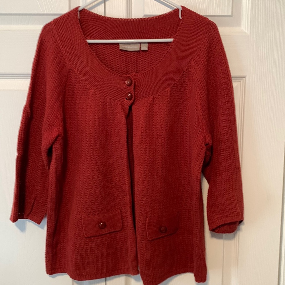 Deep orange 2-button sweater.